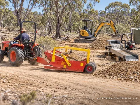 Hauling gravel past the excavator — application concept
